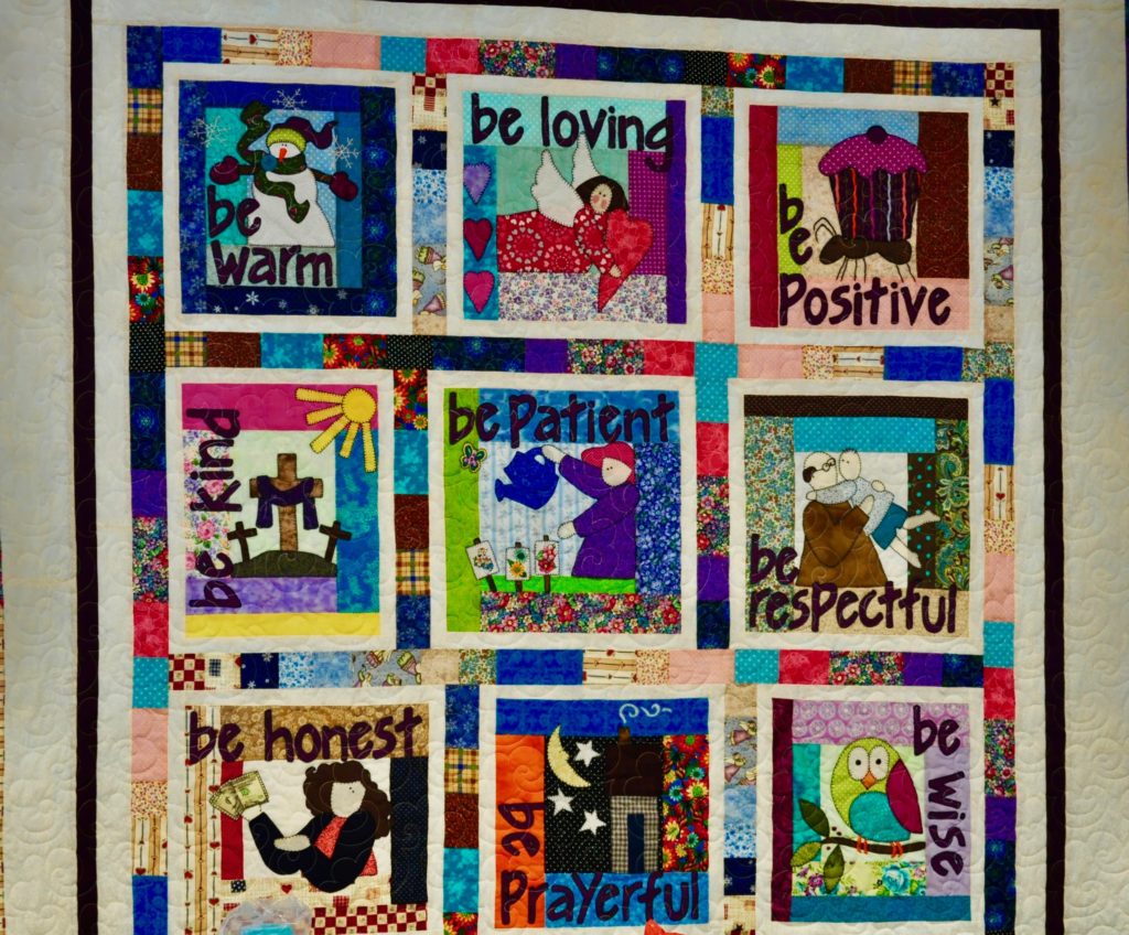 Nine colorful squares of a quilt display positive messages above images of people.